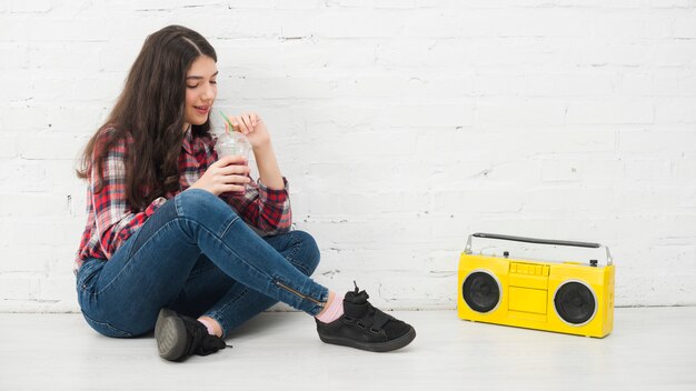 Portrait of teenage girl with smoothie