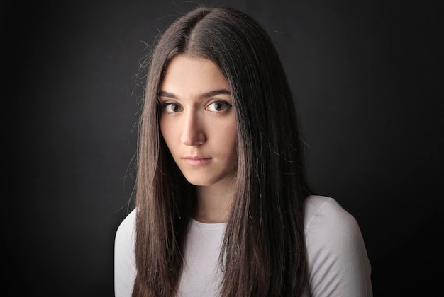 portrait of a teenager on a black background
