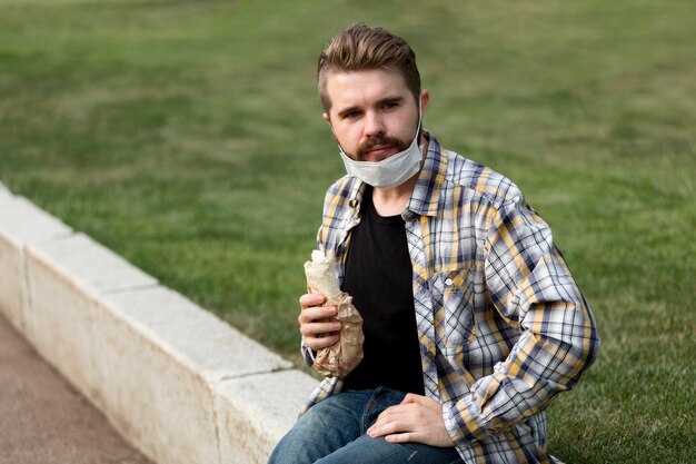 Portrait of teenager holding a kebab