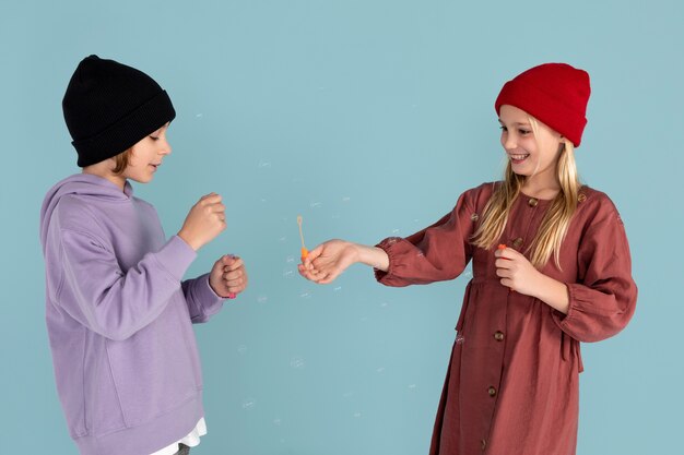 Portrait of teenagers blowing bubbles