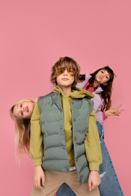 Portrait of teenagers looking serious and showing the peace sign