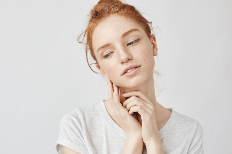 Free Photo portrait of tender ginger woman dreaming smiling.