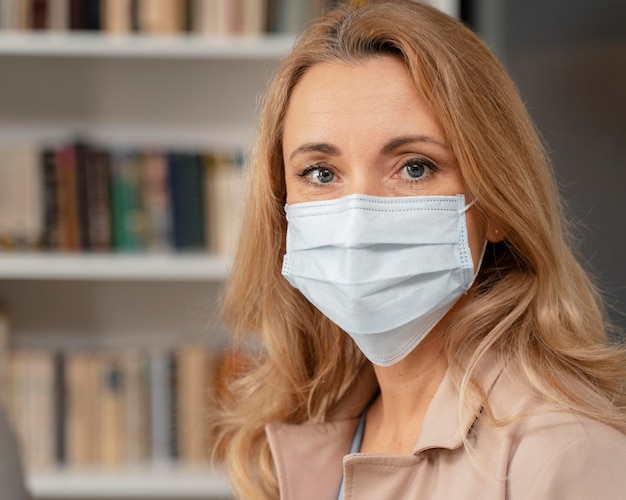 Portrait of therapist with mask in therapy office