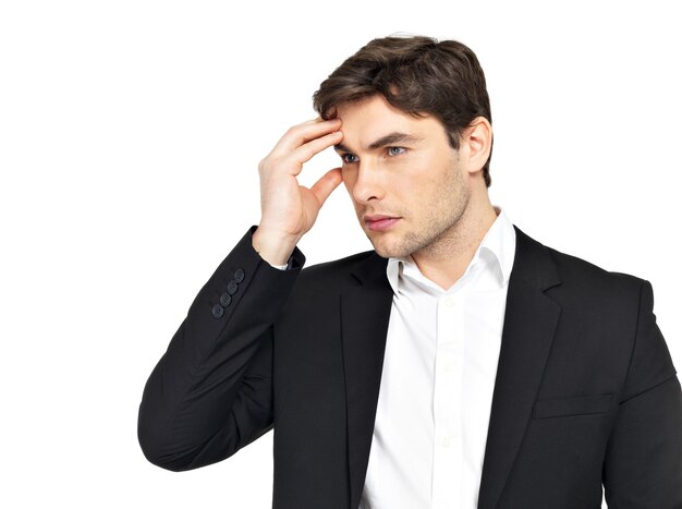 Portrait of the thinking businessman with hands at head