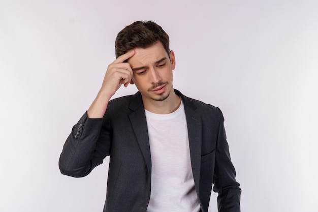 Portrait of thinking man surrounded by question mark on isolated background