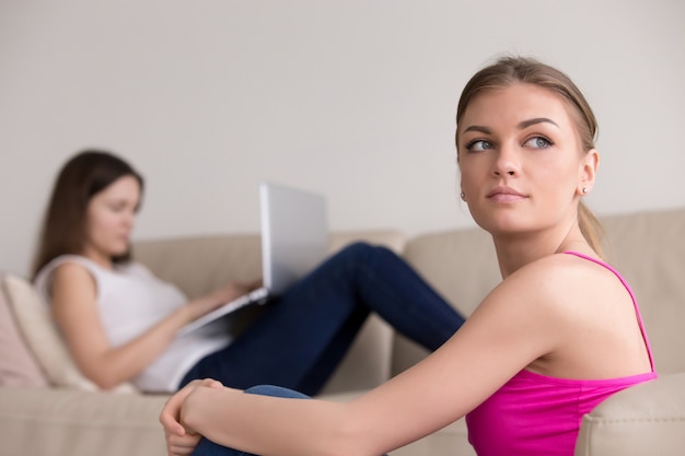 Free photo portrait of thoughtful girl, girlfriend with laptop on backgroun