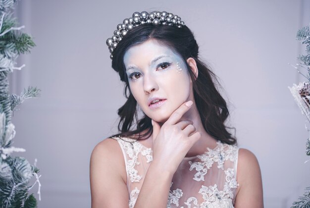 Free photo portrait of thoughtful snow queen with crown