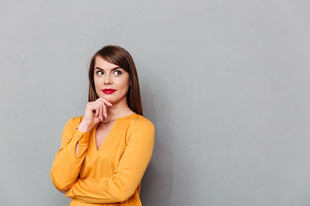 Portrait of a thoughtful woman thinking