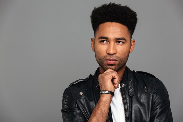 Portrait of a toughtful afro american man in leather jacket