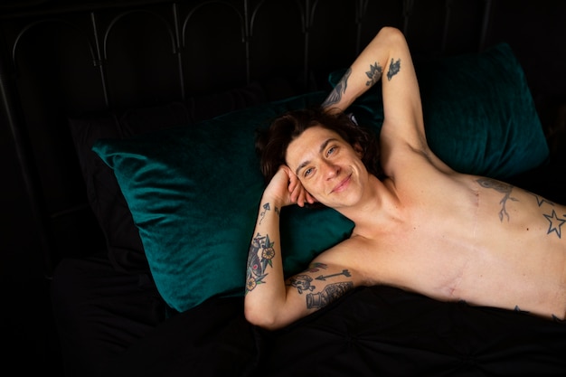 Free photo portrait of transgender man with postoperative scars