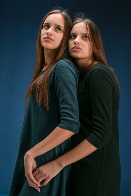 Portrait of two beautiful twin young women