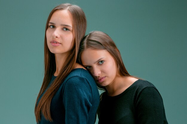 Portrait of two beautiful twin young women