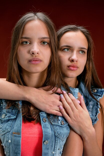 Portrait of two beautiful twin young women