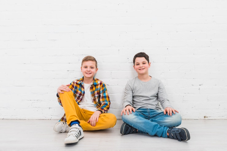 Free Photo portrait of two boys at home