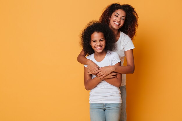 Portrait of two cheerful african sisters