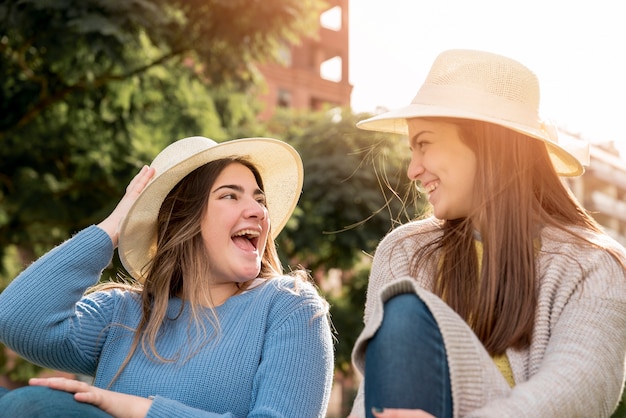 Portrait of two girls in urban environment having fun