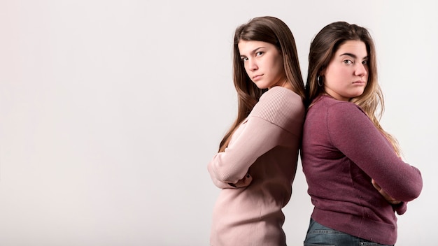 Portrait of two girls on white background