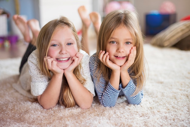 Portrait of two sisters at home