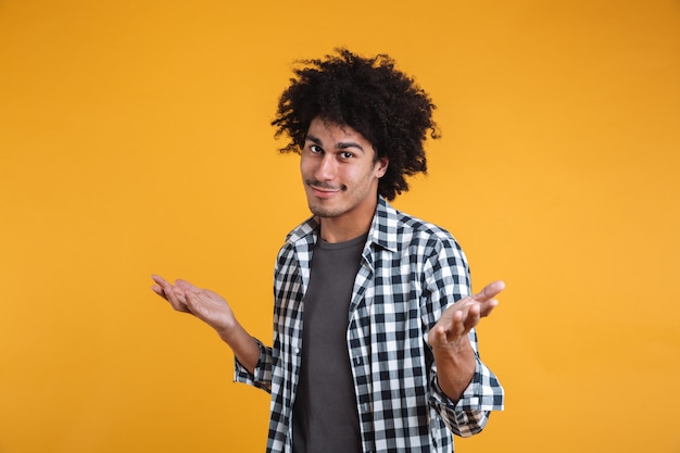 Free photo portrait of an unconfident young afro american man