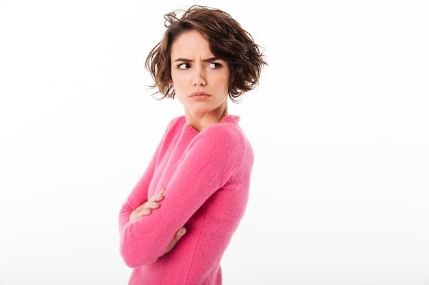 Free photo portrait of an upset angry girl standing and looking away