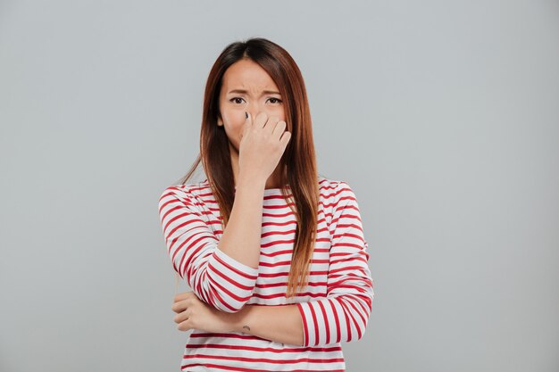 Portrait of a an upset disappointed asian woman crying