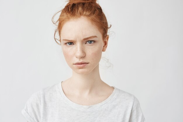Portrait of upset redhead woman.
