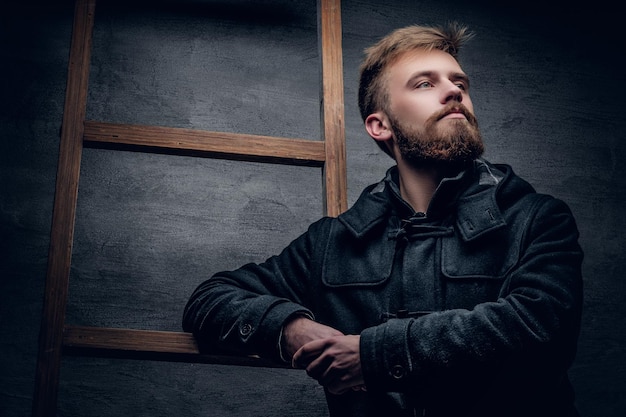 Free photo portrait of urban bearded male dressed in a black stylish winter jacket.