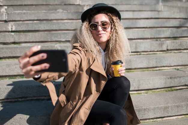 Portrait of urban teenager taking a selfie