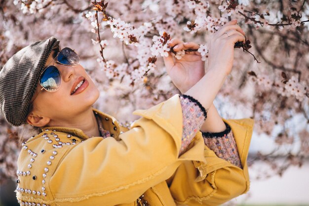 Portrait of woman in blooming flowers