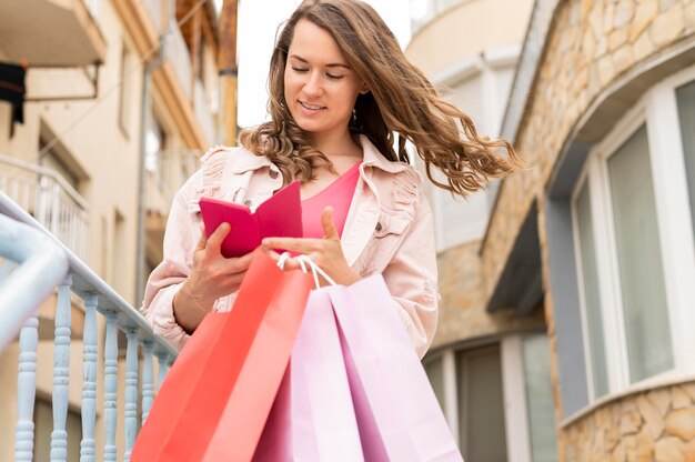 Portrait of woman carrying shopping bags