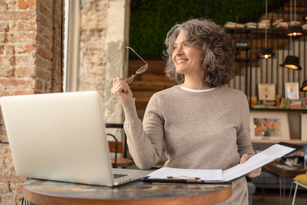 portrait woman checking clipboard