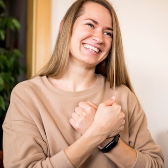 Portrait of woman communicating through sign language