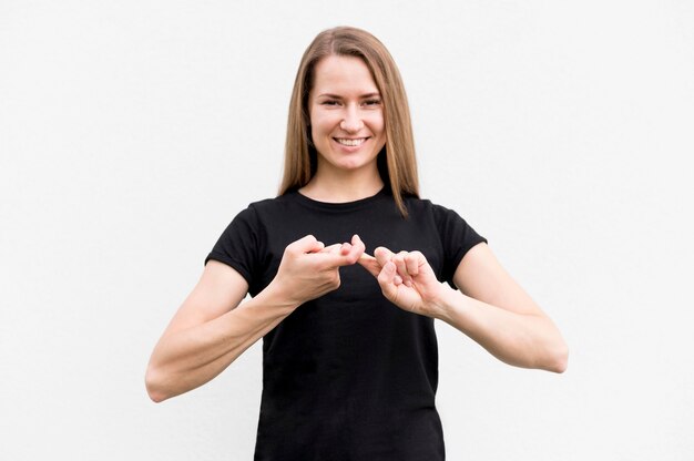 Portrait of woman communicating through sign language