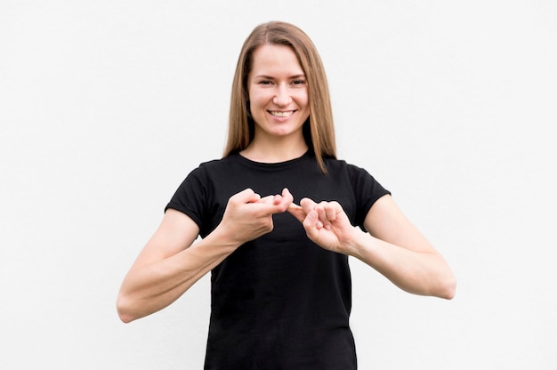 portrait of woman communicating through sign language