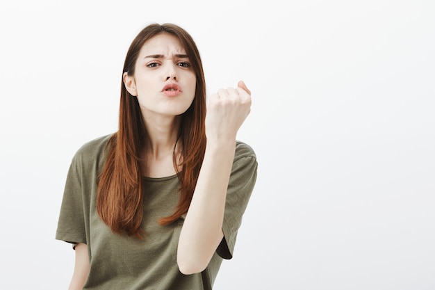 Free photo portrait of a woman in a dark green tshirt