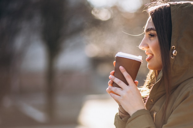 Portrait of woman drinking coffee