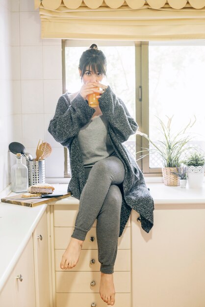 Portrait of a woman drinking juice