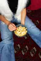 Free photo portrait of woman enjoying a dish of poutine