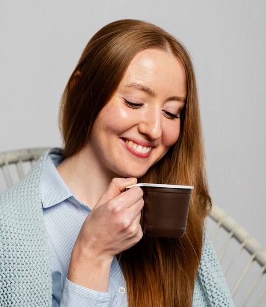 Portrait woman holding cup