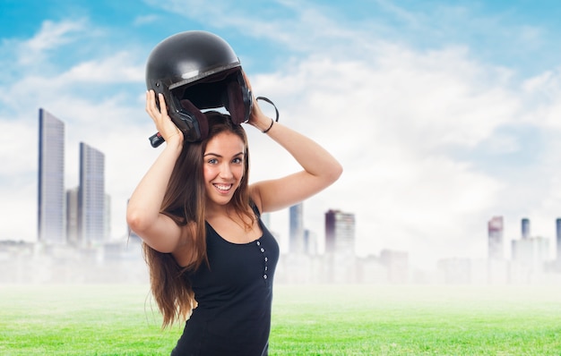 Free photo portrait of woman holding helmet under head.