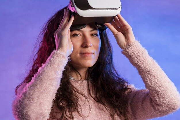 Portrait of woman holding a vr set with hands