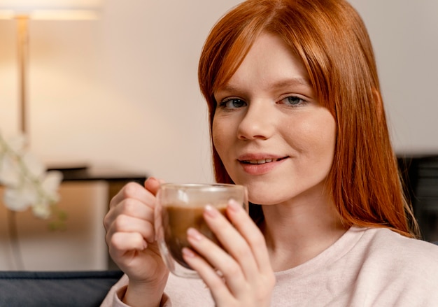 Portrait woman at home drinking coffee