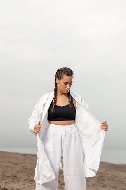 Portrait of woman in karate costume