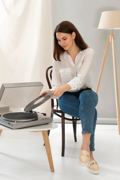 Portrait woman listening music at pick up