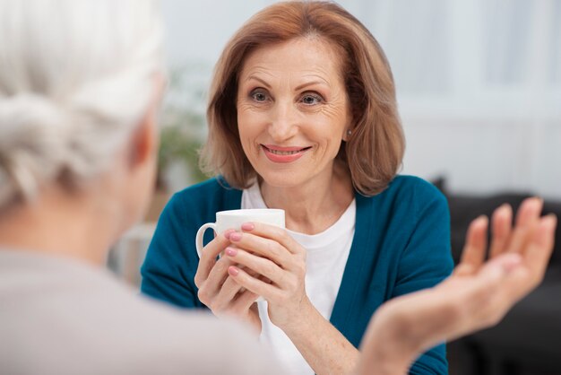 Portrait of woman looking at her friend