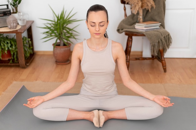 Free photo portrait woman meditating