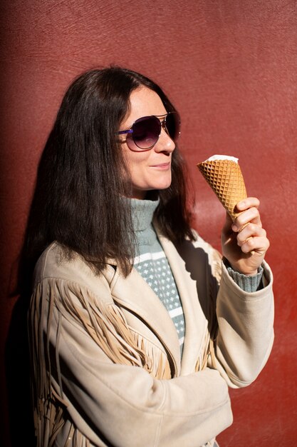 Portrait of woman outdoors with ice cream cone