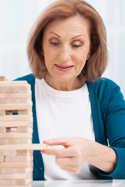 Portrait of woman playing jenga