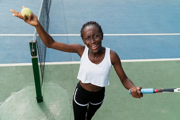 Portrait woman playing tennis