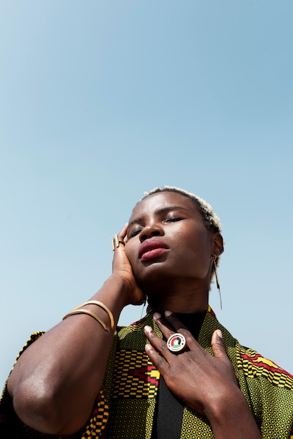 Portrait of woman posing in traditional african attire outdoors